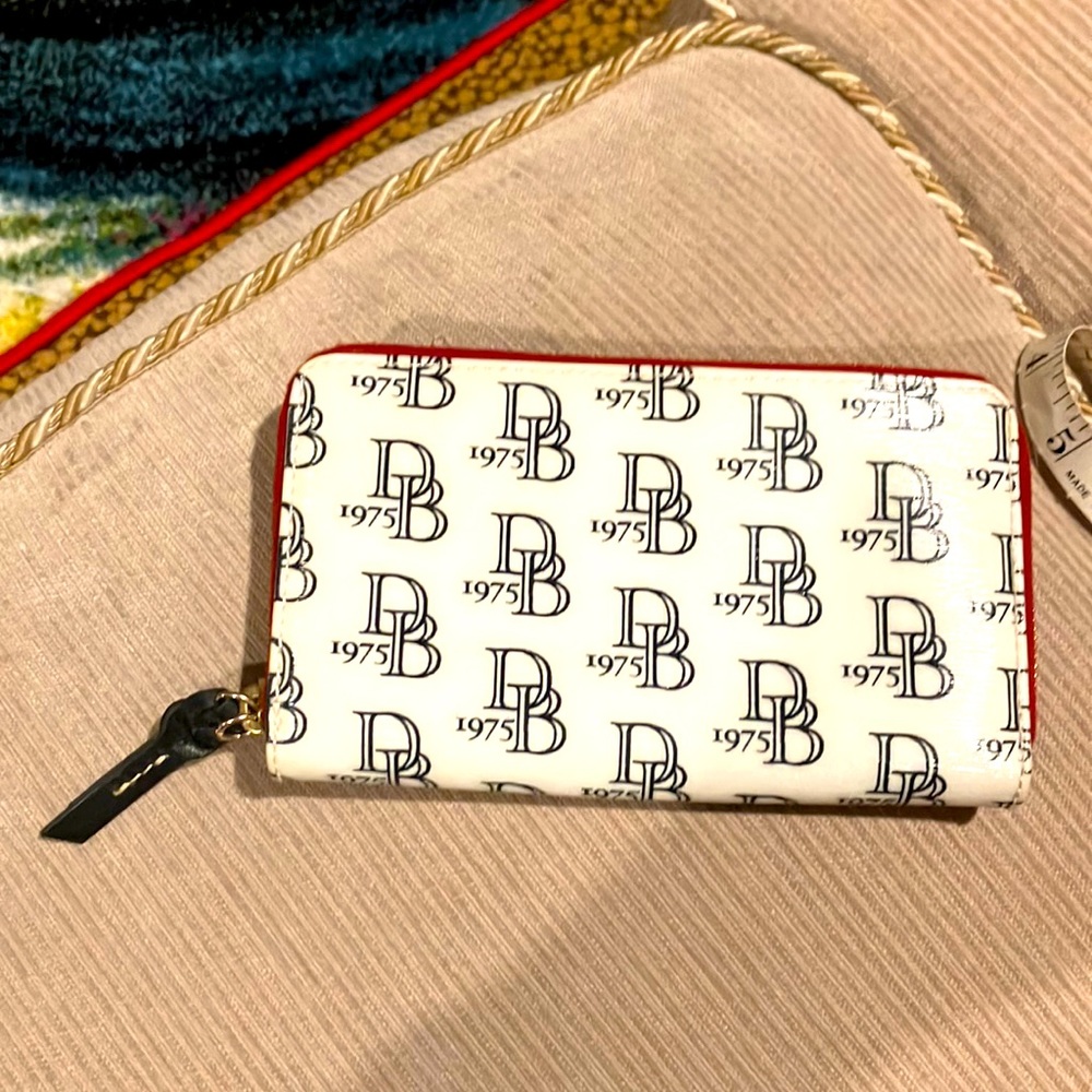Dooney and Bourke DB 1975 logo super round red interior wallet, very roomie